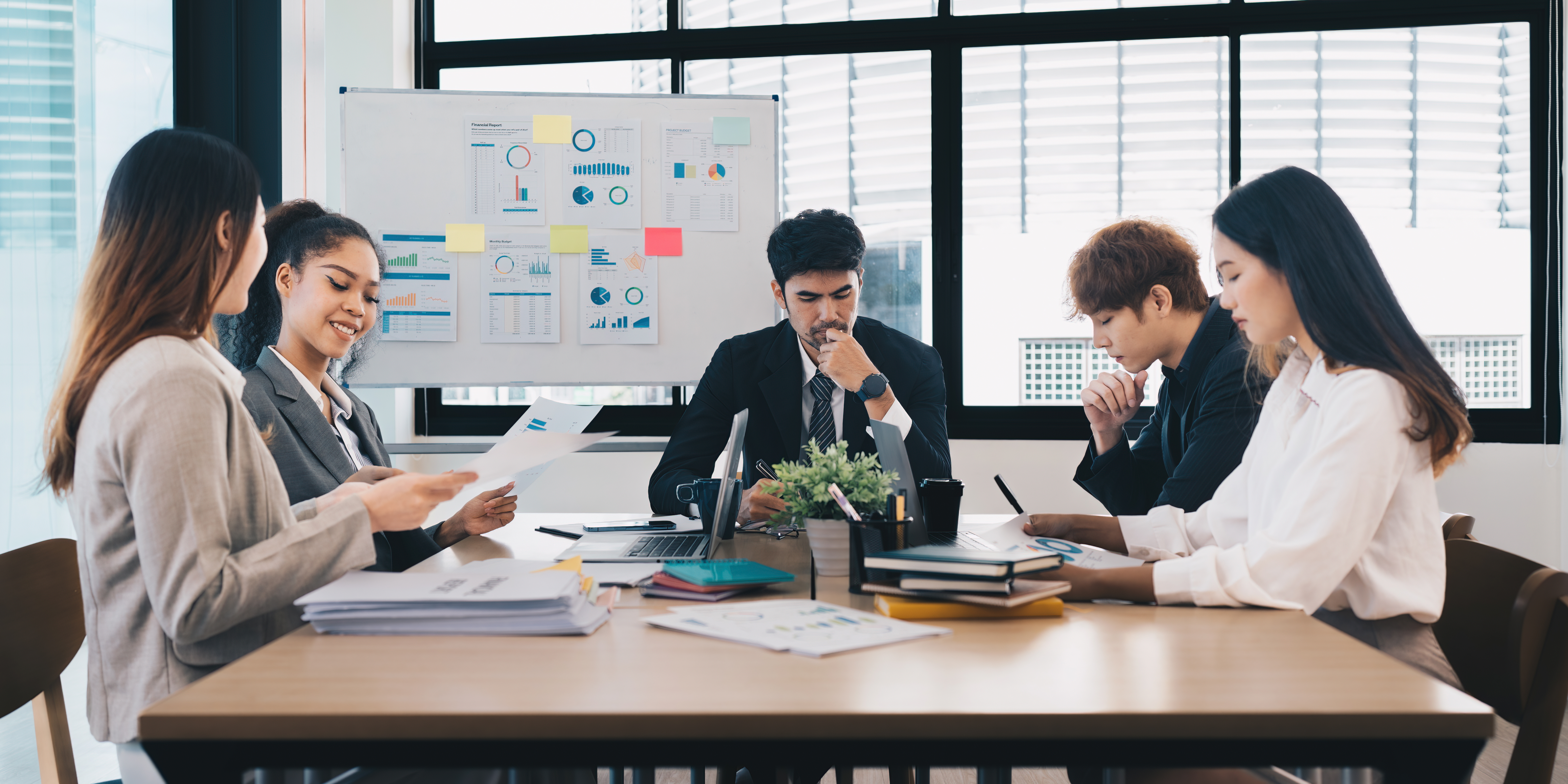 Financial Analyst discussing with Investment Banker at Meeting Room. Fund investment concept